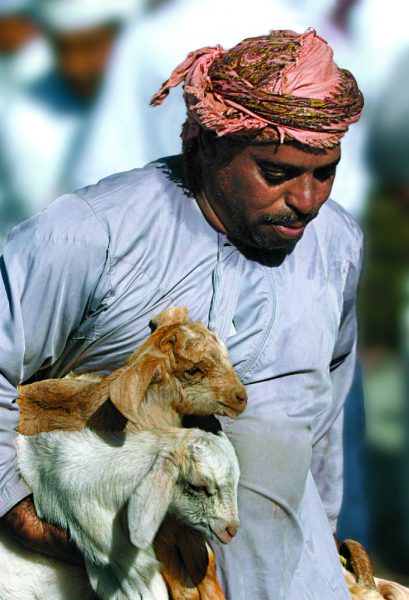 Omani man with goat